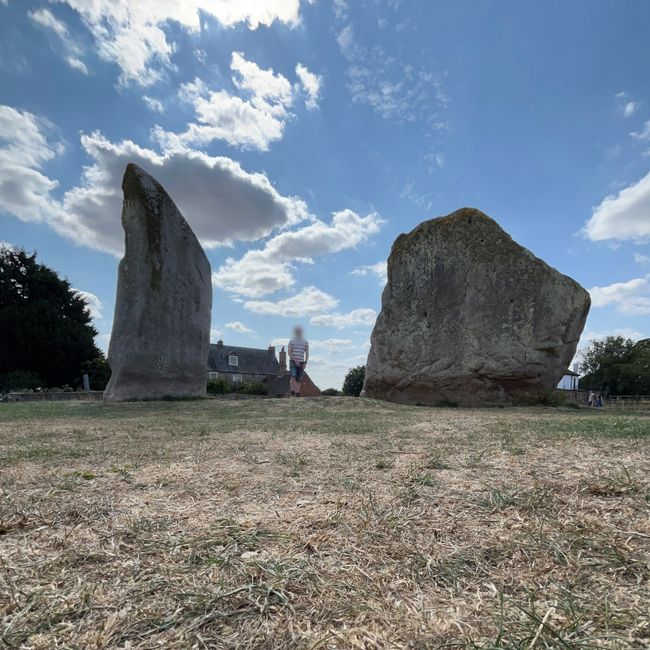 Two large stones with a person in the middle